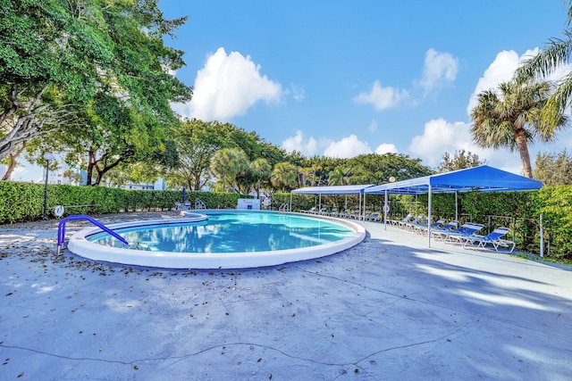 1480 NW 80th Ave Unit 201, Margate, FL 33063 - community pool with a patio area and fence
