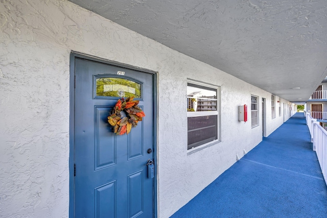 1480 NW 80th Ave Unit 201, Margate, FL 33063 - doorway to property featuring stucco siding