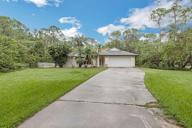 view of front of house with a garage and a front lawn