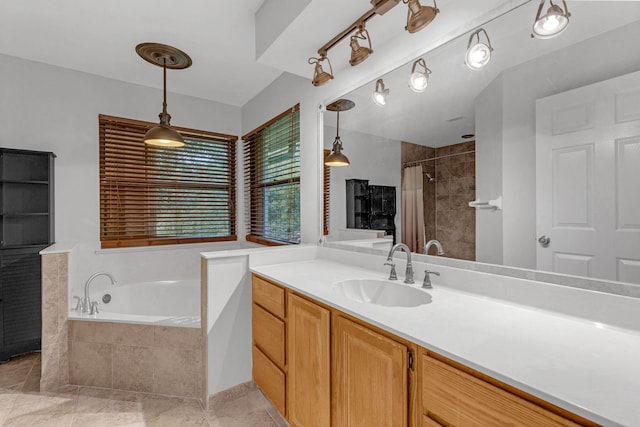 bathroom with tile patterned flooring, vanity, and plus walk in shower