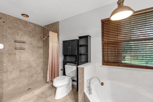 bathroom featuring plus walk in shower, tile patterned flooring, and toilet