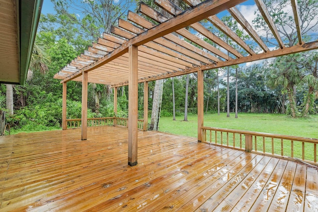 wooden deck featuring a yard and a pergola