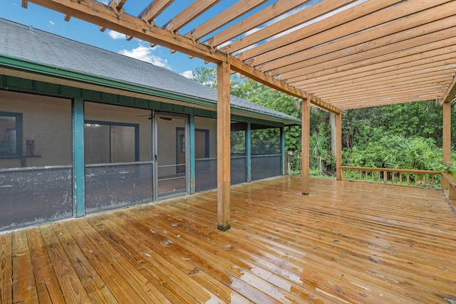 wooden terrace featuring a sunroom and a pergola