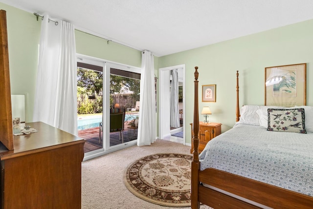 bedroom featuring access to outside and light colored carpet