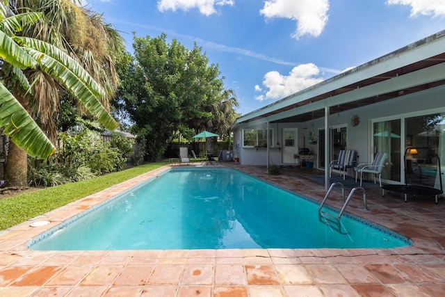 view of pool featuring a patio