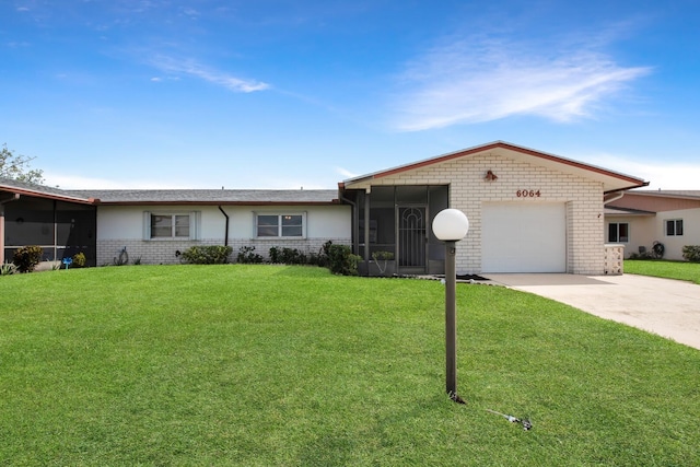 single story home featuring a garage, a front lawn, and a sunroom