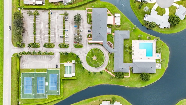 birds eye view of property with a water view