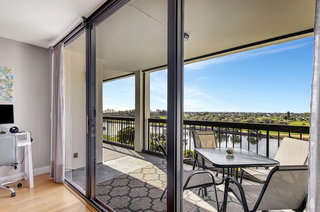 balcony featuring a water view