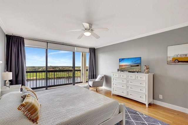 bedroom featuring expansive windows, access to exterior, ceiling fan, crown molding, and light wood-type flooring