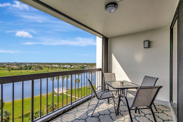 balcony featuring a water view