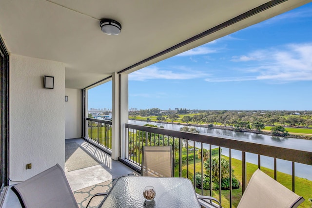 balcony featuring a water view