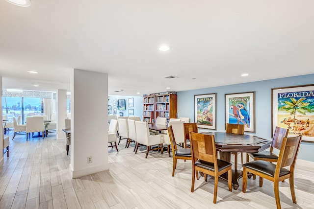 dining space featuring light wood-type flooring