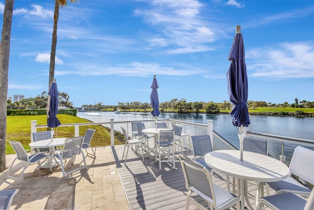 view of patio with a water view