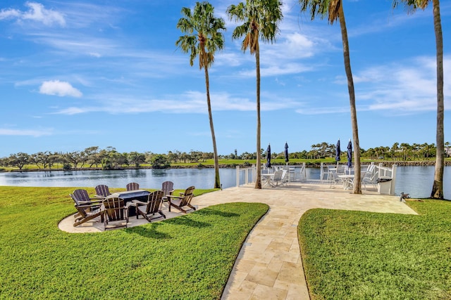 view of yard featuring a patio and a water view