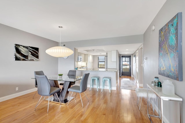 dining room featuring light hardwood / wood-style flooring