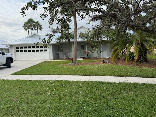 view of front of home featuring a garage and a front lawn