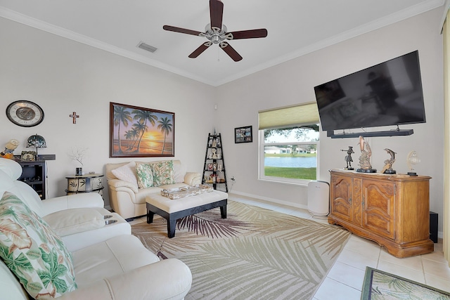 living room with ceiling fan, light tile patterned floors, and ornamental molding