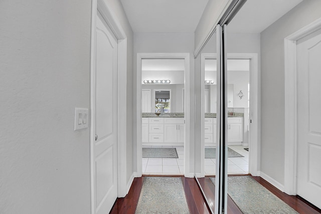 corridor with dark wood-type flooring