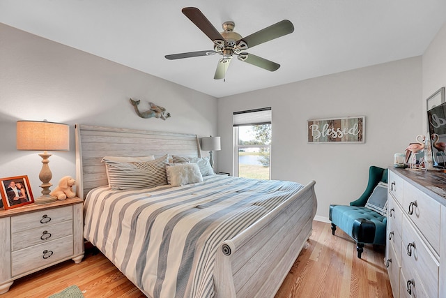 bedroom featuring light hardwood / wood-style floors and ceiling fan