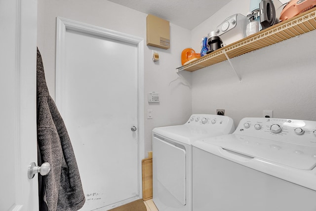 laundry room featuring separate washer and dryer