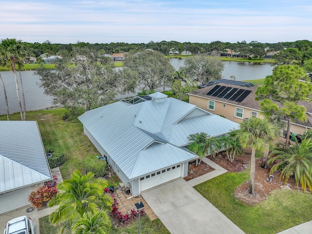 birds eye view of property with a water view