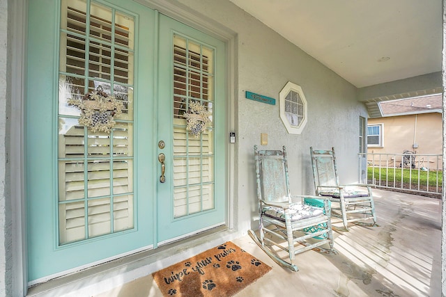 entrance to property featuring a porch