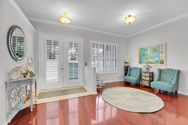 entryway with french doors, hardwood / wood-style flooring, and ornamental molding