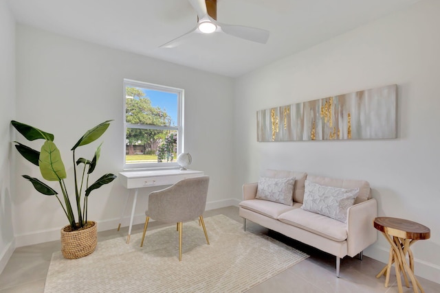 tiled home office featuring ceiling fan