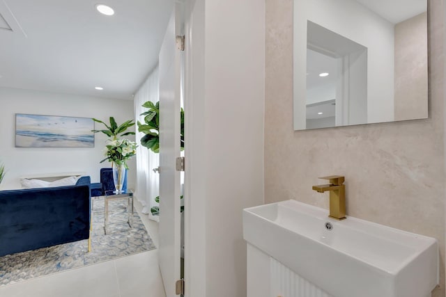 bathroom with sink and tile patterned flooring