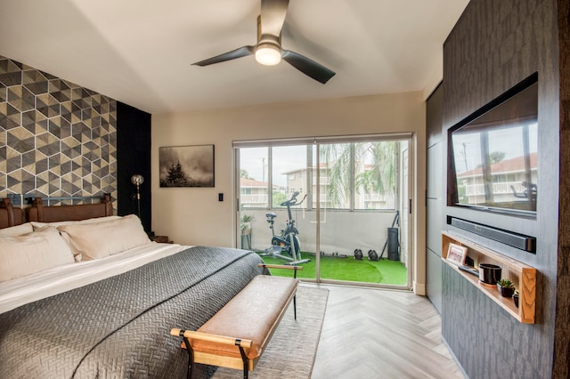 bedroom with light parquet floors and ceiling fan