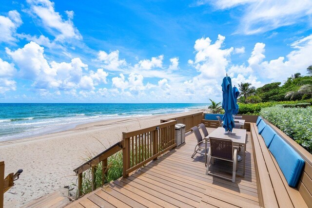 1147 Hillsboro Mile Unit 701, Hillsboro Beach, FL 33062 - deck featuring a water view, outdoor dining area, and a view of the beach