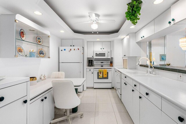 1147 Hillsboro Mile Unit 701, Hillsboro Beach, FL 33062 - kitchen featuring a sink, ceiling fan, white appliances, and white cabinetry