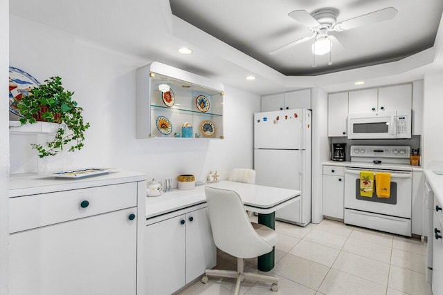 1147 Hillsboro Mile Unit 701, Hillsboro Beach, FL 33062 - kitchen featuring a ceiling fan, light countertops, white cabinets, recessed lighting, and white appliances