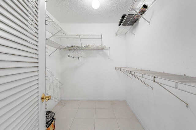 1147 Hillsboro Mile Unit 701, Hillsboro Beach, FL 33062 - walk in closet featuring light tile patterned floors