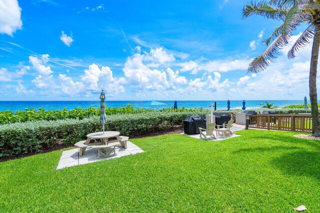 1147 Hillsboro Mile Unit 701, Hillsboro Beach, FL 33062 - view of yard with a patio and a water view