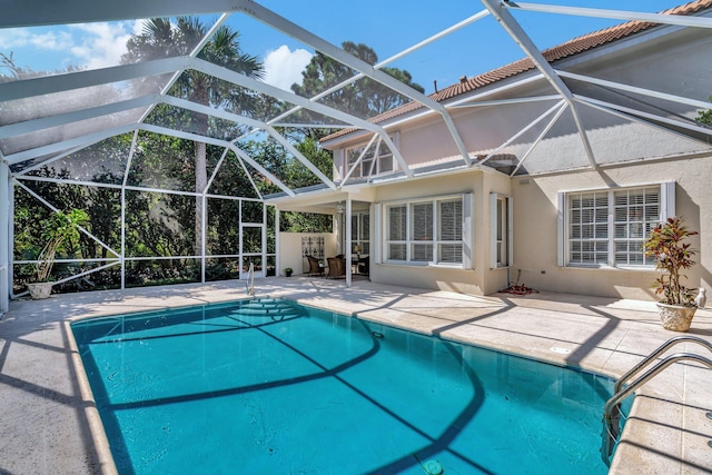 view of pool with a lanai and a patio area