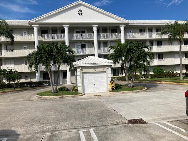 2811 Village Blvd Unit 106, West Palm Beach, FL 33409 - view of apartment building / complex with driveway