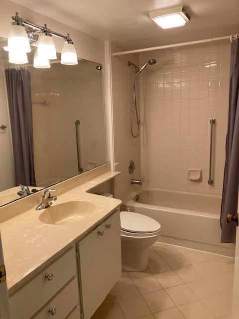 2811 Village Blvd Unit 106, West Palm Beach, FL 33409 - bathroom with tile patterned flooring, shower / tub combo, vanity, and toilet