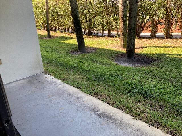 2811 Village Blvd Unit 106, West Palm Beach, FL 33409 - view of grassy yard