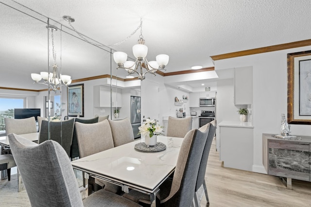 dining space with a chandelier, crown molding, a textured ceiling, and light hardwood / wood-style floors