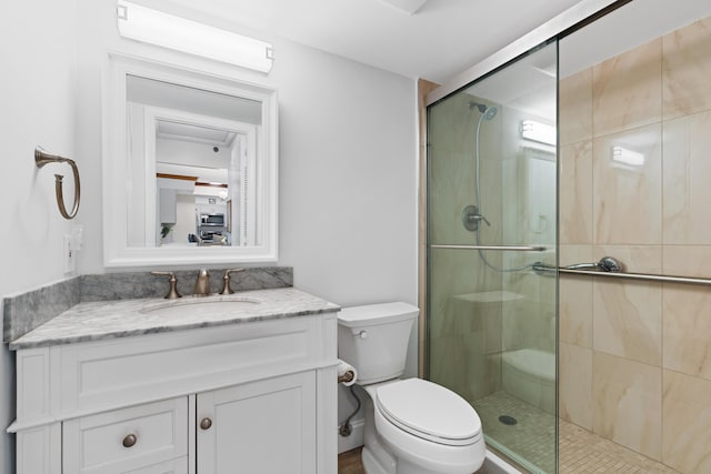 3301 S Ocean Blvd Unit 405, Highland Beach, FL 33487 - bathroom featuring toilet, a shower stall, and vanity