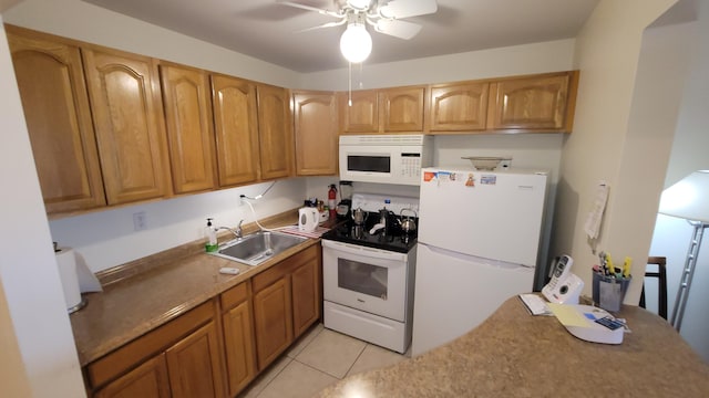 kitchen featuring white appliances, sink, light tile patterned floors, and ceiling fan