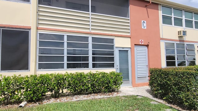 entrance to property with an AC wall unit