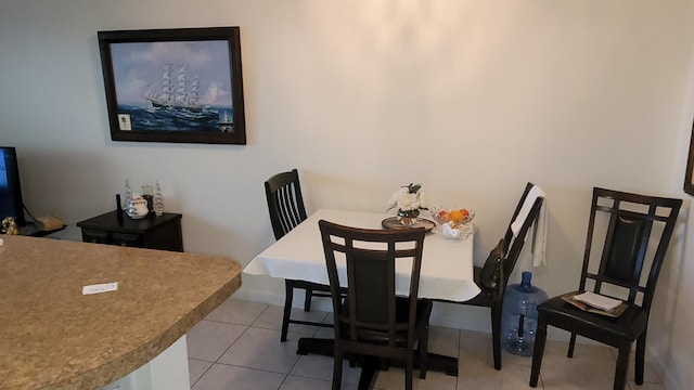 dining room with light tile patterned flooring