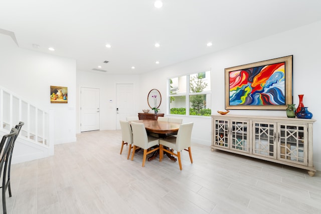 dining space featuring light hardwood / wood-style floors