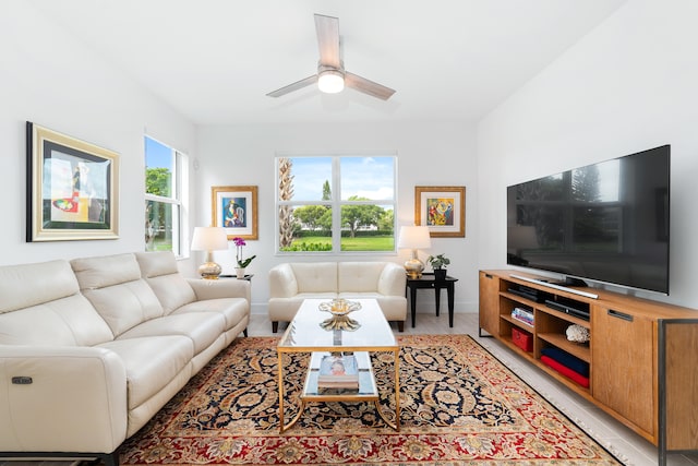 living room with ceiling fan and plenty of natural light