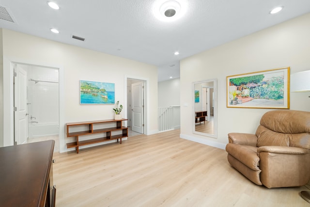 sitting room with light hardwood / wood-style flooring