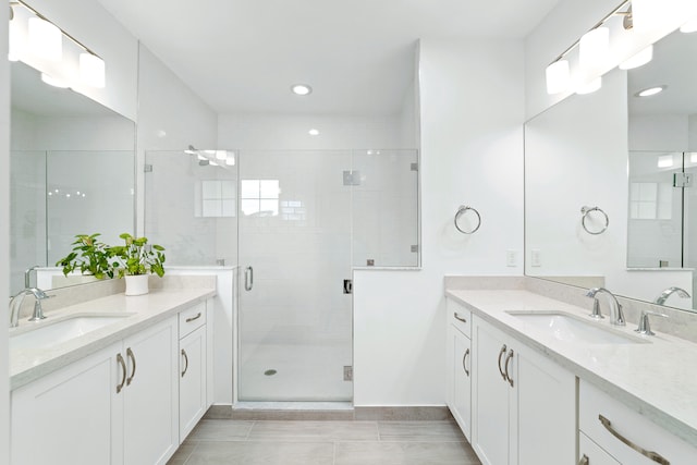 bathroom featuring vanity, wood-type flooring, and an enclosed shower