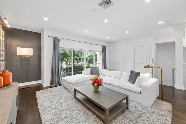 living room featuring dark hardwood / wood-style flooring