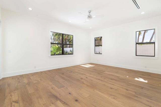 unfurnished room with light wood-type flooring and ceiling fan